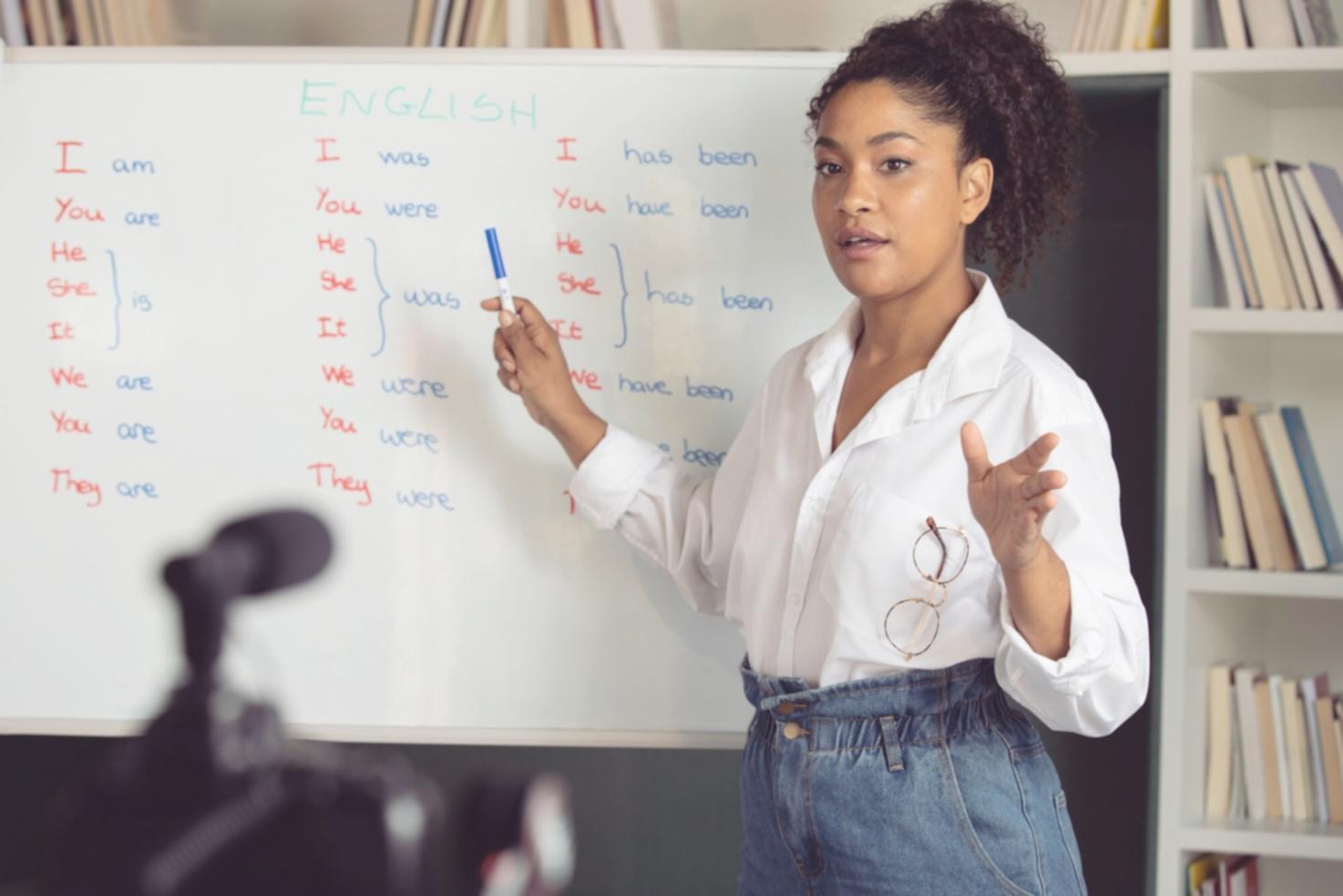 Professional workshop session showing participants mapping budget workflow processes on whiteboards